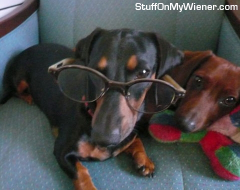 Parker in a pair of glasses, Benchley looking on.