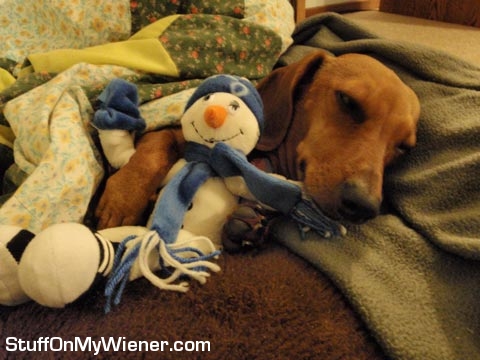 Page snuggles with a snowman.